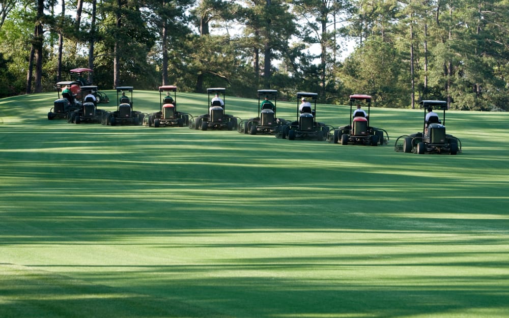 Augusta, Georgia / United States - April 2010: Groundskeepers at Augusta National performing synchronized mowing and golf course maintenance activities