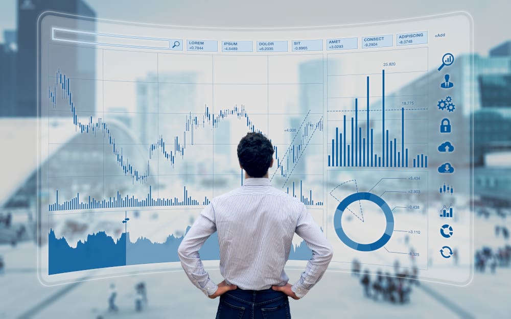 An businessman looking at a huge chart with building on the background